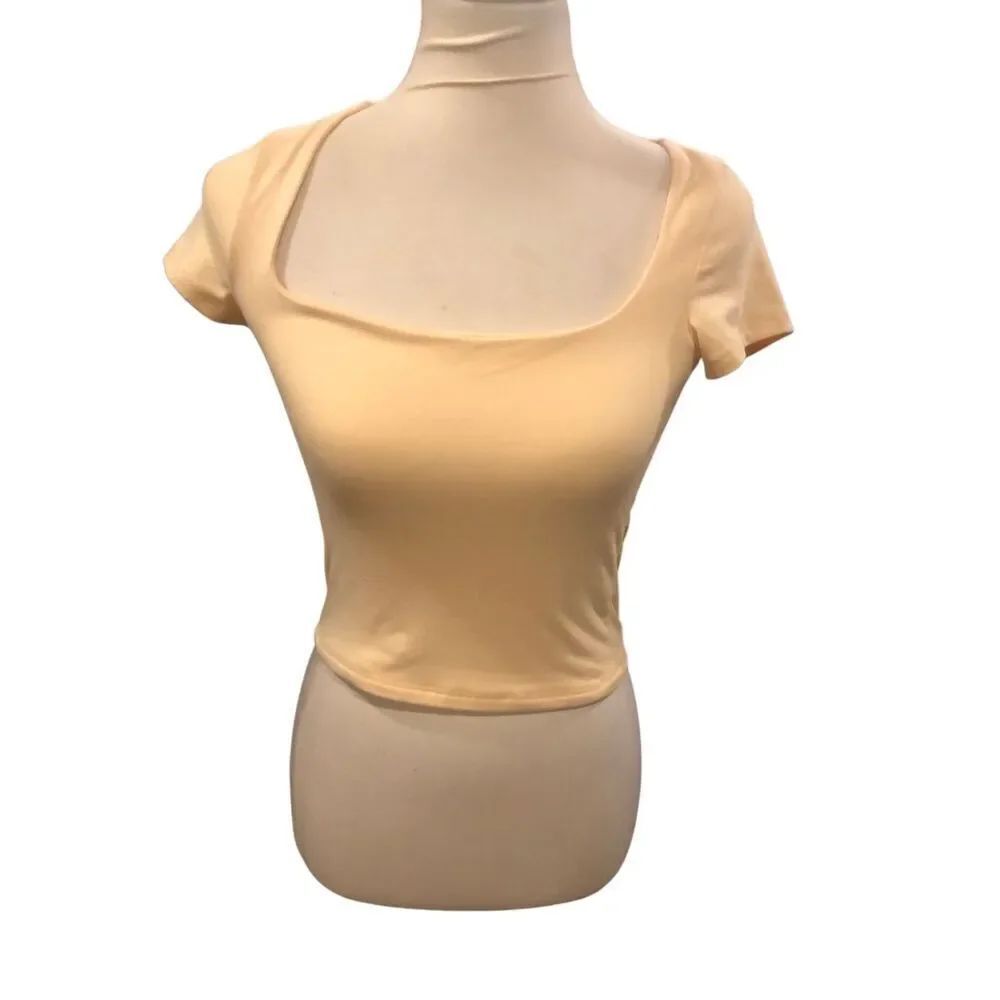 Sincerely Jules yellow/light peach crop top features a distinct square neckline